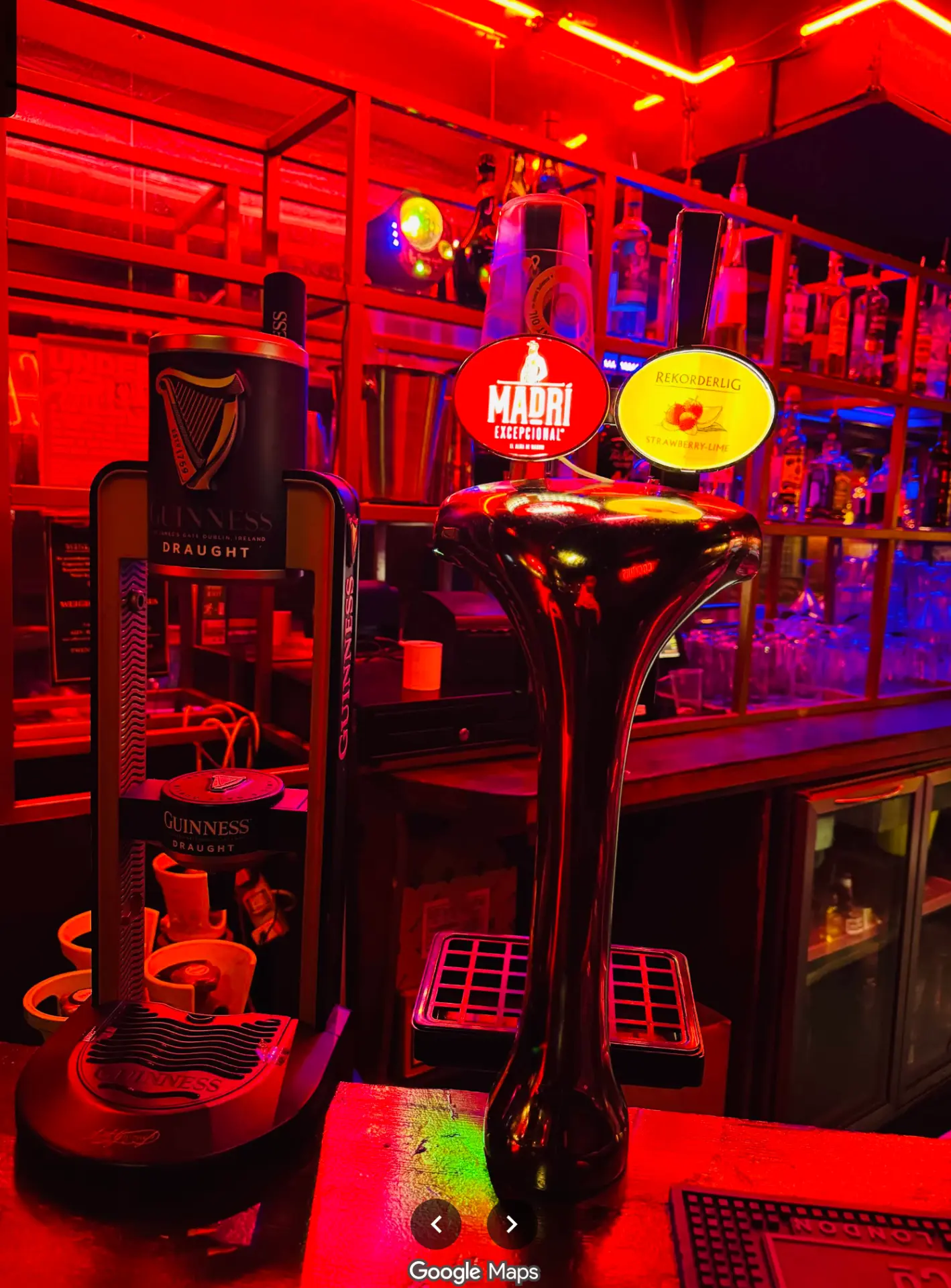 Beer taps on the bar at 331 Old St under red and blue neon light